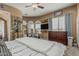 Bedroom featuring a ceiling fan, vanity, and large windows at 3754 E Flintlock Dr, Queen Creek, AZ 85142