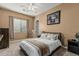 Bedroom featuring neutral walls and a large framed jersey on the wall at 3754 E Flintlock Dr, Queen Creek, AZ 85142