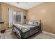 Bedroom featuring neutral walls and a metal frame bed at 3754 E Flintlock Dr, Queen Creek, AZ 85142