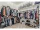 Large walk-in closet featuring custom shelving and racks, maximizing storage space at 3754 E Flintlock Dr, Queen Creek, AZ 85142