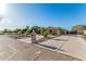 Charming single-story home with circular driveway and desert landscaping, set on a sprawling lot at 3754 E Flintlock Dr, Queen Creek, AZ 85142