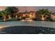 Elegant desert home with a stone facade, grand entrance, and a meticulously landscaped front yard at 3754 E Flintlock Dr, Queen Creek, AZ 85142