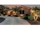Beautiful single-story desert home with circle driveway and tasteful landscaping at 3754 E Flintlock Dr, Queen Creek, AZ 85142