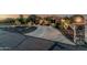 Inviting desert home featuring a curved driveway, tasteful landscaping, and an impressive stone mailbox pillar at 3754 E Flintlock Dr, Queen Creek, AZ 85142