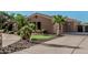 Well maintained house with grass lawn, desert landscaping, and a large driveway at 3754 E Flintlock Dr, Queen Creek, AZ 85142