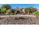 Stunning single-story home with stone accents, circular driveway, and beautiful desert landscaping at 3754 E Flintlock Dr, Queen Creek, AZ 85142