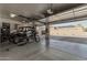 Bright and spacious garage featuring ample storage, high ceilings, and parking space for multiple vehicles and equipment at 3754 E Flintlock Dr, Queen Creek, AZ 85142