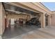 Spacious three-car garage with ample storage, equipped for projects and housing recreational vehicles, offering versatility and organization at 3754 E Flintlock Dr, Queen Creek, AZ 85142