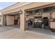 Well-organized three-car garage with abundant cabinet storage and space for multiple vehicles, providing functionality and convenience at 3754 E Flintlock Dr, Queen Creek, AZ 85142
