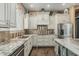 Bright kitchen featuring granite countertops, stainless steel appliances, and ample cabinetry at 3754 E Flintlock Dr, Queen Creek, AZ 85142