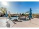 Resort-style pool with a rock waterfall feature, integrated spa, and ample deck space for lounging at 3754 E Flintlock Dr, Queen Creek, AZ 85142