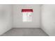 Carpeted bedroom with window dressed with simple red curtains allows ample light at 411 N Cordoba Pl, Chandler, AZ 85226