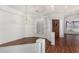Bright dining room with hardwood floors, white walls, and an elegant chandelier at 411 N Cordoba Pl, Chandler, AZ 85226