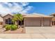 Charming single-story home with a three-car garage, desert landscaping, and a tile roof at 411 N Cordoba Pl, Chandler, AZ 85226