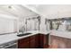 Spacious kitchen featuring marble countertops, wood cabinets, and views to backyard at 411 N Cordoba Pl, Chandler, AZ 85226