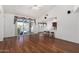 Open floor plan showcasing wood floors and views of the patio and pool area at 411 N Cordoba Pl, Chandler, AZ 85226