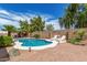 Inviting backyard oasis with a pool, gazebo, patio area, and lush greenery, perfect for outdoor enjoyment at 411 N Cordoba Pl, Chandler, AZ 85226
