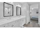 This bathroom features a double sink vanity with matching mirrors and a shower in the background at 4156 E Jesse St, Gilbert, AZ 85295