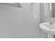 Bathroom featuring a pedestal sink, neutral walls, and modern fixtures at 4156 E Jesse St, Gilbert, AZ 85295