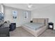 This spacious bedroom features neutral walls, carpet, windows, and an upholstered bed frame at 4156 E Jesse St, Gilbert, AZ 85295