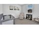 This bedroom features neutral walls, carpet, one window, and a crib and chair at 4156 E Jesse St, Gilbert, AZ 85295