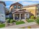 Two-story home featuring a covered porch, landscaped yard, and stone accents at 4156 E Jesse St, Gilbert, AZ 85295