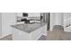 Stylish kitchen with stainless steel appliances, granite countertops, and a large island with a breakfast bar at 4156 E Jesse St, Gilbert, AZ 85295