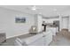 Bright living space showcasing neutral tones, an open layout, and a view into the modern kitchen at 4156 E Jesse St, Gilbert, AZ 85295