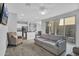 Bright, open-concept living room with modern furniture, ceiling fan, and sliding glass doors for natural light at 4156 E Jesse St, Gilbert, AZ 85295