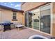 Covered outdoor patio featuring a barbecue grill, seating, and brick pavers at 4156 E Jesse St, Gilbert, AZ 85295