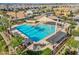 Community pool area with a large pool, sunshades, and ample seating at 4156 E Jesse St, Gilbert, AZ 85295