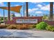 Entrance sign to Fulton Town Square at Fulton Homes with colorful flowers at 4156 E Jesse St, Gilbert, AZ 85295