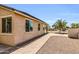Inviting backyard with desert landscaping, paver walkway, and privacy, creating a serene outdoor retreat at 41769 W Canasta Ln, Maricopa, AZ 85138