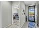 Bright entryway with tile flooring and view into the bedroom at 41769 W Canasta Ln, Maricopa, AZ 85138