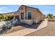Beautiful single-story home featuring desert landscaping, a gated entry, and private courtyard at 41769 W Canasta Ln, Maricopa, AZ 85138