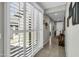 Hallway with tile floors and natural light, with glass slider to outside at 41769 W Canasta Ln, Maricopa, AZ 85138