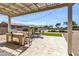Covered patio featuring a built-in outdoor kitchen and barbecue area, perfect for entertaining and outdoor dining at 41769 W Canasta Ln, Maricopa, AZ 85138