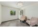 Bright bedroom features a ceiling light fixture, a window, and closet with shelving at 4317 E Yucca St, Phoenix, AZ 85028