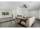 Open dining space with a large table, booth seating, neutral walls, and seamless access to other living areas at 4317 E Yucca St, Phoenix, AZ 85028