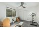 Bright exercise room features a ceiling fan, gray tile flooring, and workout equipment at 4317 E Yucca St, Phoenix, AZ 85028