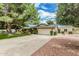 Well maintained single story home with a driveway and mature trees in a well-maintained front yard at 4317 E Yucca St, Phoenix, AZ 85028
