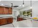 Well-lit kitchen featuring a stainless steel sink, granite counters, custom cabinets and stainless steel appliances at 4317 E Yucca St, Phoenix, AZ 85028