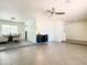 Open-concept living room with tile floors and modern decor; dining area visible at 4317 E Yucca St, Phoenix, AZ 85028