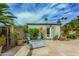 Outdoor patio features a fire pit, ample seating, and lush landscaping at 4317 E Yucca St, Phoenix, AZ 85028