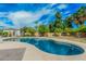 Relaxing backyard pool surrounded by desert landscaping including citrus trees and a hammock at 4317 E Yucca St, Phoenix, AZ 85028