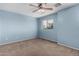 Relaxing bedroom with a ceiling fan and window for natural light at 4413 E Odessa Dr, San Tan Valley, AZ 85140