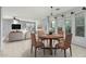 This dining area features a round table, seating for four, and an open view into the living room at 4413 E Odessa Dr, San Tan Valley, AZ 85140
