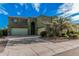 Inviting two-story home boasts three-car garage and meticulously landscaped front yard, perfect for curb appeal at 4413 E Odessa Dr, San Tan Valley, AZ 85140