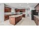 Well-lit kitchen with ample counter space, an island, and stainless steel appliances at 4413 E Odessa Dr, San Tan Valley, AZ 85140