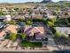 Bird's eye view of a home featuring a pool, desert landscaping, and unique turf design at 4637 W Misty Willow Ln, Glendale, AZ 85310